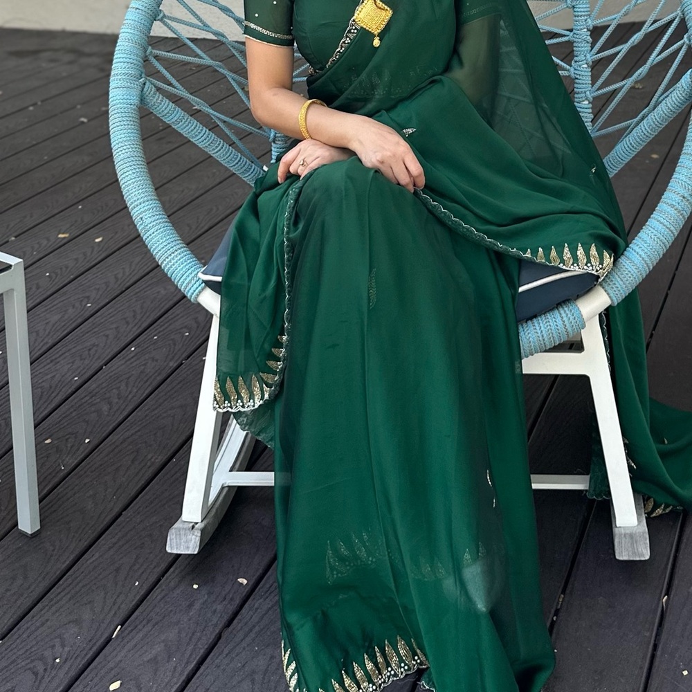 Elegant Green Sari with Gold Accents